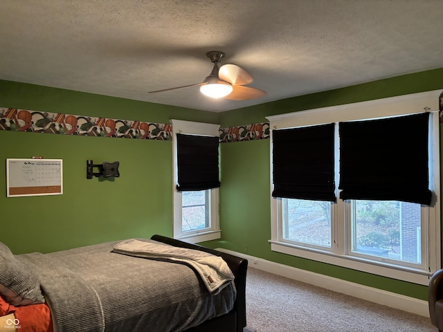 48 N Audubon Rd, Indianapolis, IN 46219 - carpeted bedroom with ceiling fan and a textured ceiling