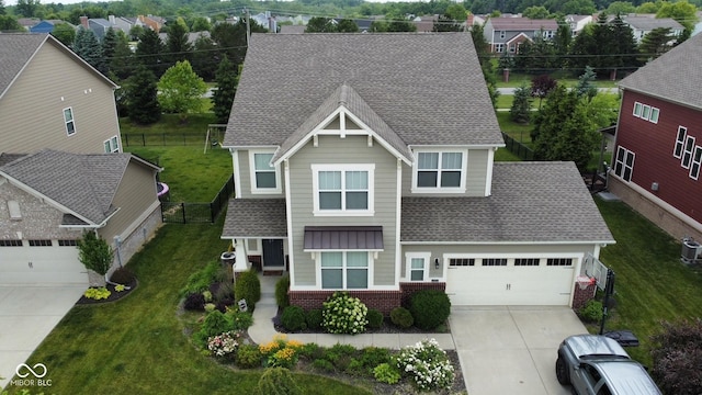 5684 Autumn Trl, Brownsburg, IN 46112 - view of front of home featuring concrete driveway, roof with shingles, brick siding, an attached garage, and central AC unit