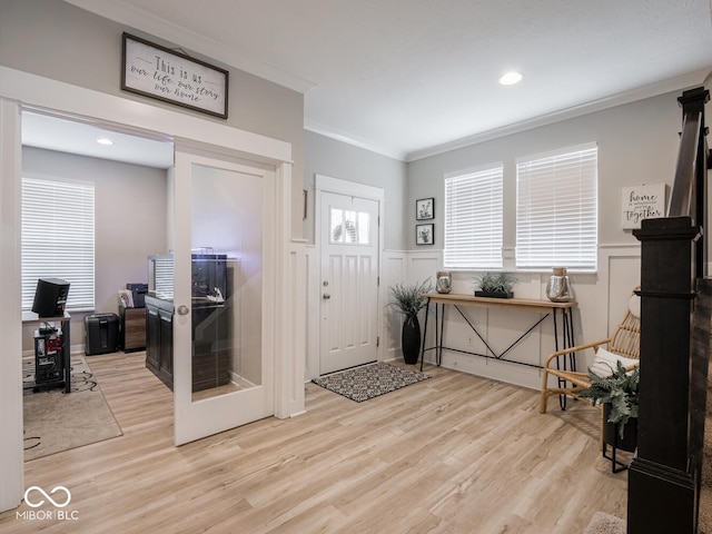 5684 Autumn Trl, Brownsburg, IN 46112 - foyer entrance featuring ornamental molding, wood finished floors, wainscoting, a decorative wall, and recessed lighting