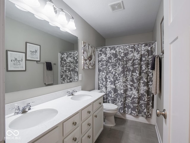5684 Autumn Trl, Brownsburg, IN 46112 - bathroom with double vanity, toilet, curtained shower, and tile patterned flooring
