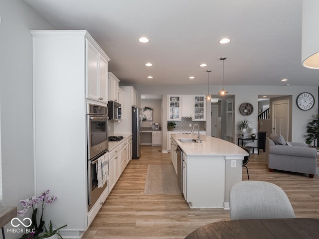 5684 Autumn Trl, Brownsburg, IN 46112 - kitchen featuring a sink, appliances with stainless steel finishes, light wood-type flooring, recessed lighting, and white cabinetry