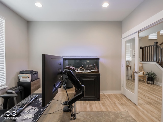 5684 Autumn Trl, Brownsburg, IN 46112 - workout area with french doors, light wood finished floors, recessed lighting, and baseboards