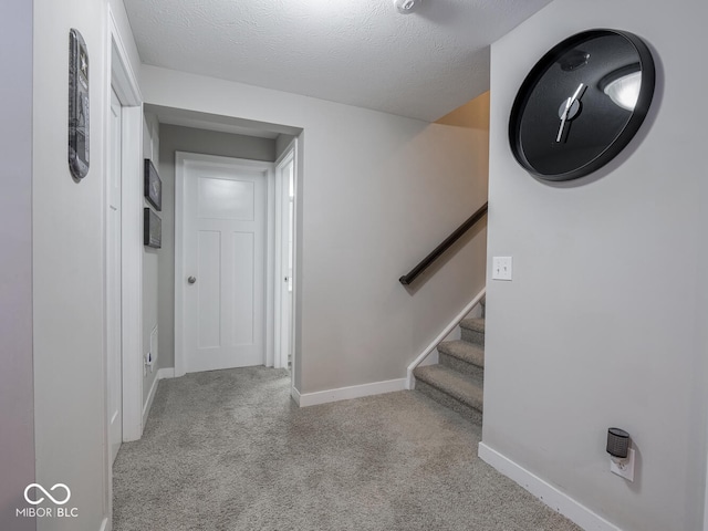 5684 Autumn Trl, Brownsburg, IN 46112 - corridor with carpet flooring, baseboards, stairway, and a textured ceiling