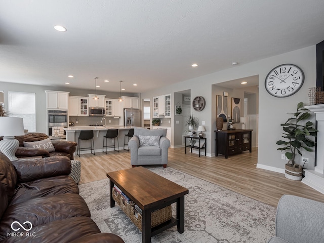 5684 Autumn Trl, Brownsburg, IN 46112 - living area with light wood-type flooring, recessed lighting, and baseboards