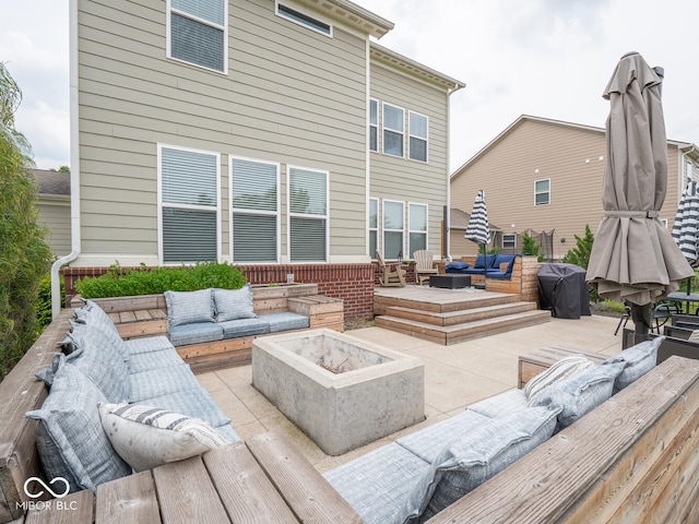 5684 Autumn Trl, Brownsburg, IN 46112 - wooden terrace with an outdoor living space with a fire pit and a patio area