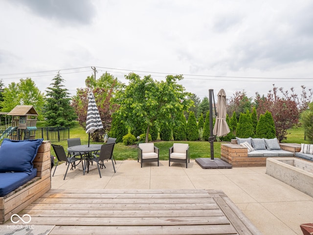 5684 Autumn Trl, Brownsburg, IN 46112 - view of patio / terrace featuring an outdoor hangout area, a playground, a deck, outdoor dining area, and view of wooded area
