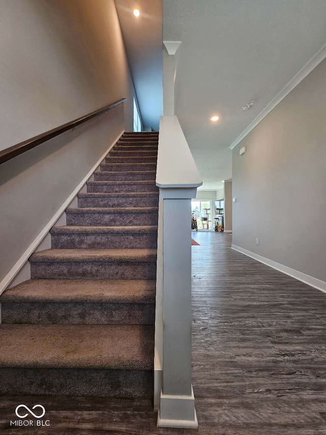 17255 Seaboard Pl, Noblesville, IN 46060 - stairs featuring wood finished floors, ornamental molding, and recessed lighting