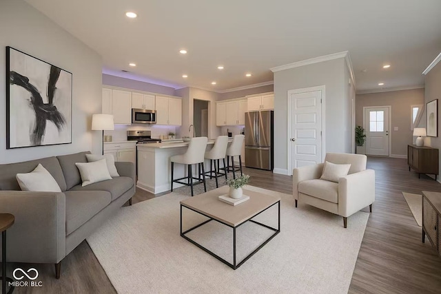 17255 Seaboard Pl, Noblesville, IN 46060 - living area featuring crown molding, wood finished floors, and recessed lighting