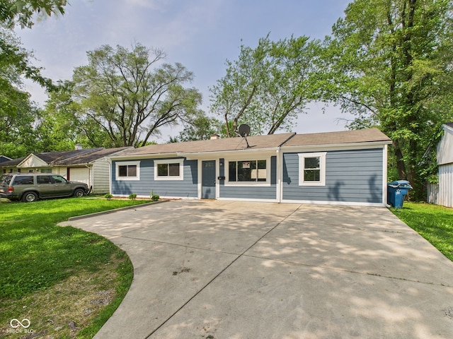 4020 N Mitthoefer Rd, Indianapolis, IN 46235 - ranch-style house with a front yard and driveway