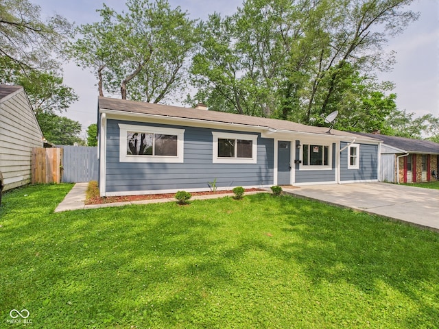 4020 N Mitthoefer Rd, Indianapolis, IN 46235 - view of front of house featuring a chimney and driveway