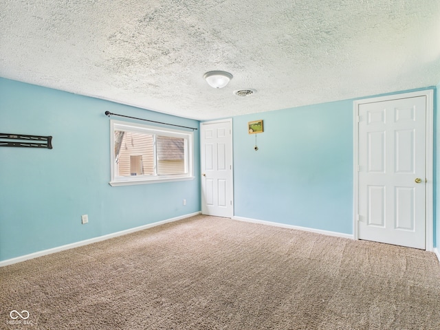 4020 N Mitthoefer Rd, Indianapolis, IN 46235 - empty room featuring carpet, a textured ceiling, and baseboards