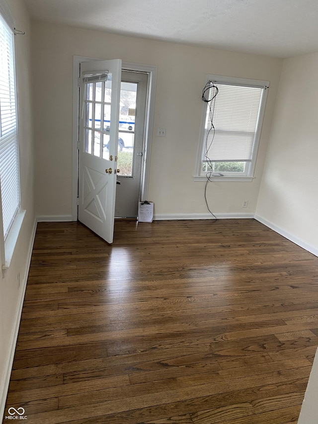 1444 N Denny St, Indianapolis, IN 46201 - entryway featuring dark wood-type flooring and baseboards