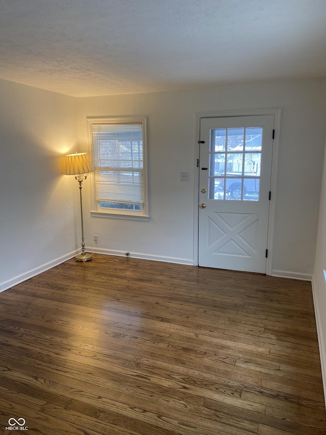 1444 N Denny St, Indianapolis, IN 46201 - entrance foyer with dark wood-type flooring and baseboards