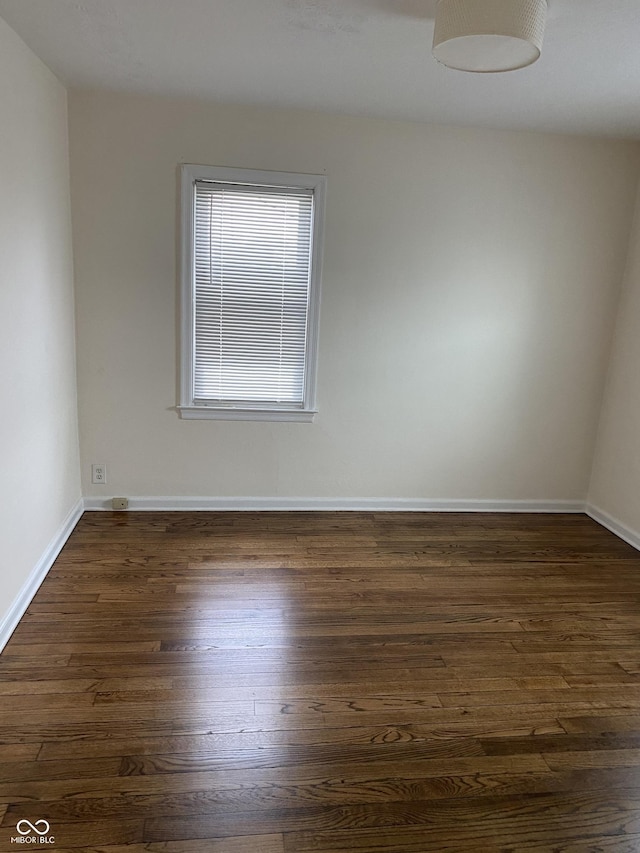 1444 N Denny St, Indianapolis, IN 46201 - unfurnished room with dark wood-type flooring and baseboards