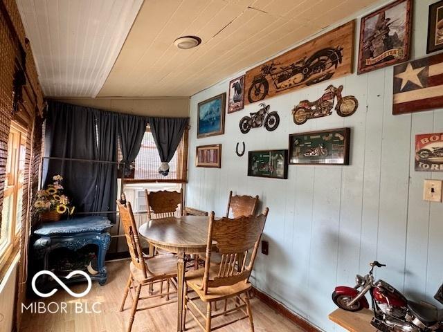 1118 S 2nd St, Lafayette, IN 47905 - dining space featuring wood finished floors and wood walls