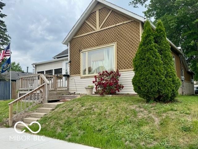 1118 S 2nd St, Lafayette, IN 47905 - view of front facade with a front yard and a wooden deck
