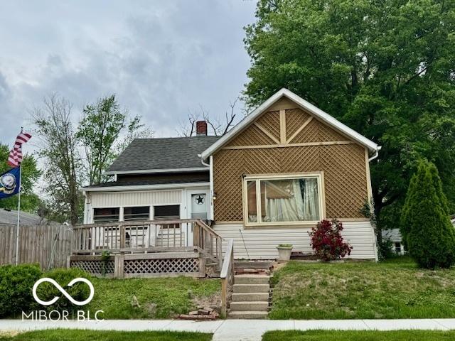 1118 S 2nd St, Lafayette, IN 47905 - view of front of house featuring a chimney, covered porch, and a shingled roof