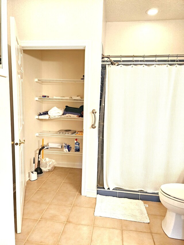 6956 Park Square Dr Unit D, Avon, IN 46123 - full bath with a shower stall, tile patterned flooring, toilet, recessed lighting, and baseboards