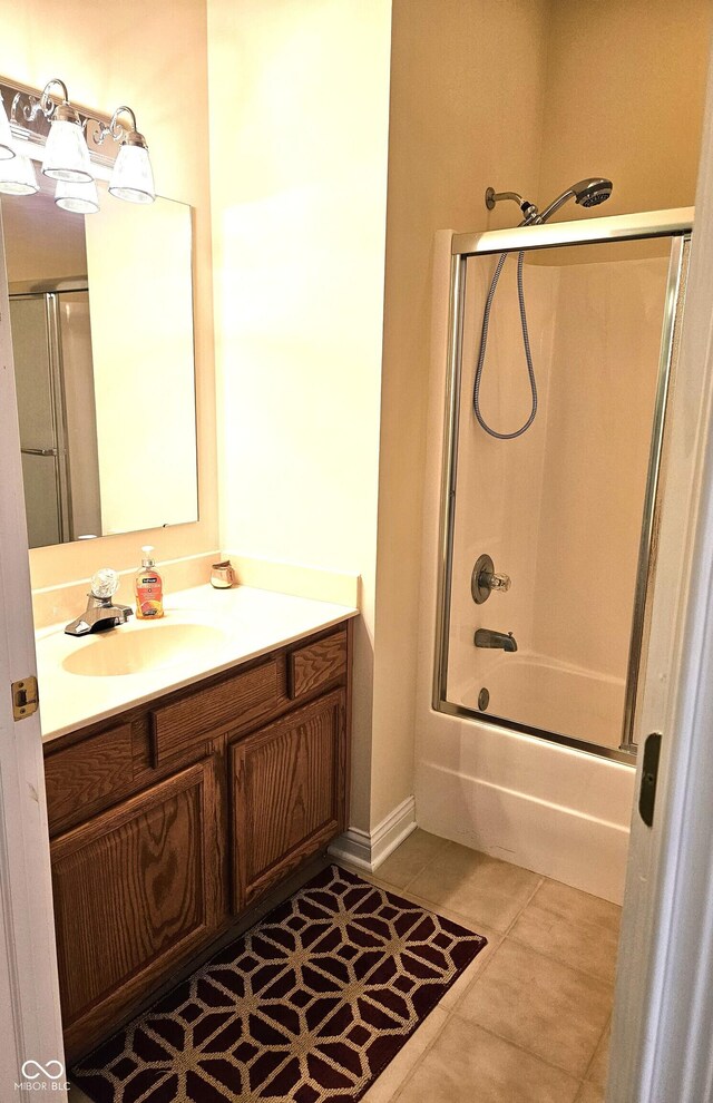 6956 Park Square Dr Unit D, Avon, IN 46123 - bathroom featuring vanity, enclosed tub / shower combo, and baseboards