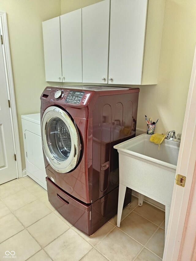 6956 Park Square Dr Unit D, Avon, IN 46123 - laundry area featuring cabinet space, light tile patterned floors, and washing machine and dryer