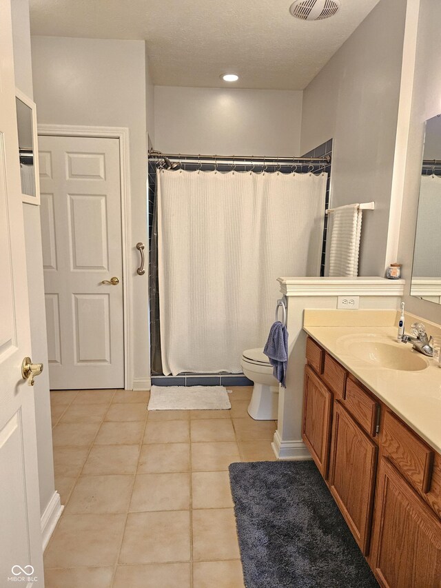 6956 Park Square Dr Unit D, Avon, IN 46123 - bathroom featuring vanity, tile patterned floors, toilet, and curtained shower