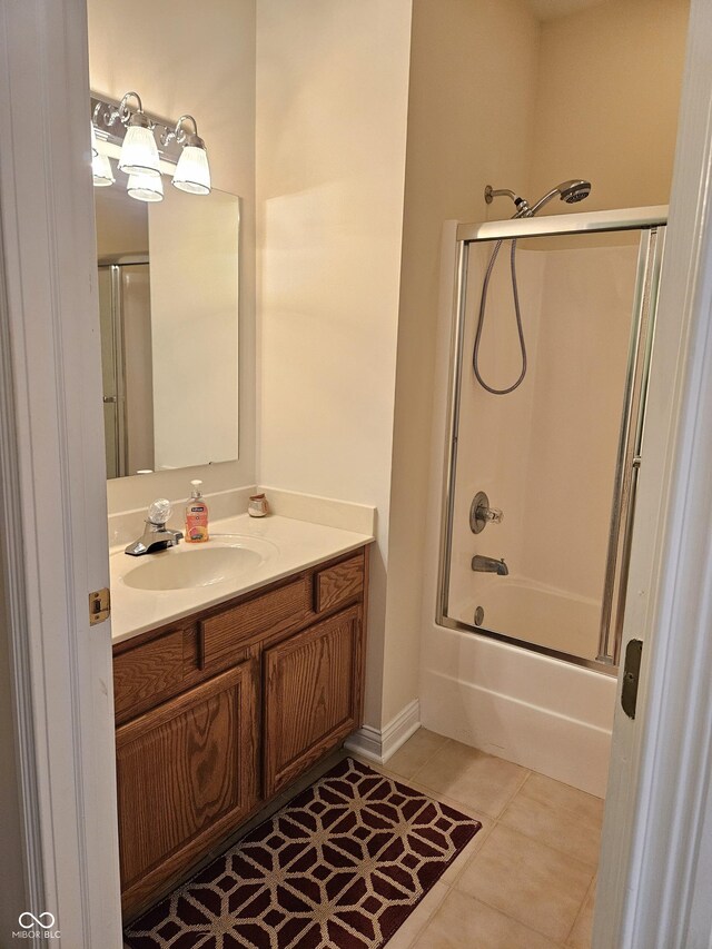 6956 Park Square Dr Unit D, Avon, IN 46123 - bathroom featuring vanity, enclosed tub / shower combo, tile patterned floors, and baseboards