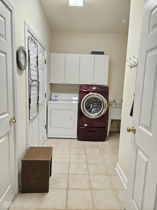 6956 Park Square Dr Unit D, Avon, IN 46123 - laundry room featuring washer and clothes dryer, light tile patterned floors, and cabinet space