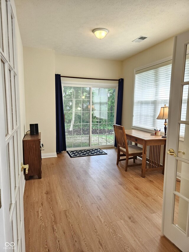 6956 Park Square Dr Unit D, Avon, IN 46123 - office featuring light wood-type flooring, a textured ceiling, and baseboards