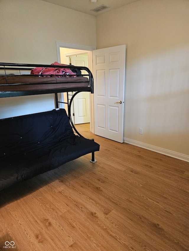 6956 Park Square Dr Unit D, Avon, IN 46123 - bedroom with wood finished floors and baseboards