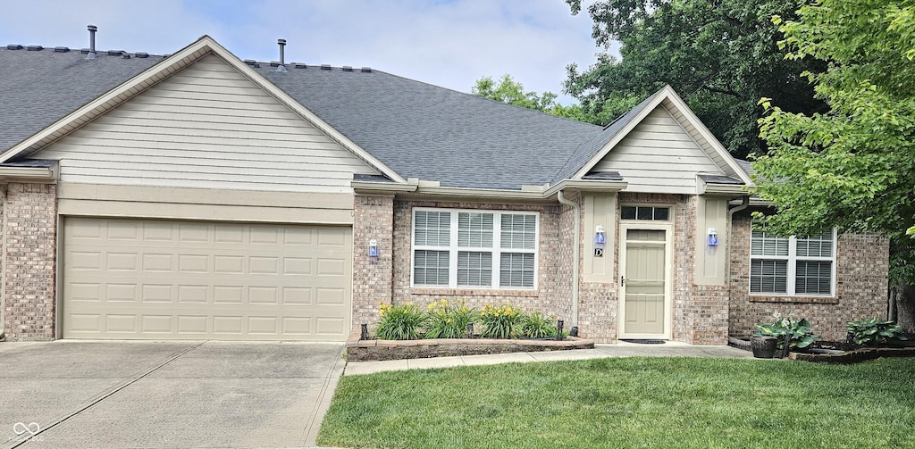 6956 Park Square Dr Unit D, Avon, IN 46123 - ranch-style home with brick siding, driveway, an attached garage, a front yard, and a shingled roof