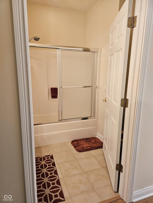 6956 Park Square Dr Unit D, Avon, IN 46123 - full bath with shower / bath combination with glass door and tile patterned flooring