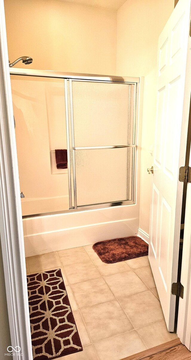 6956 Park Square Dr Unit D, Avon, IN 46123 - full bathroom featuring bath / shower combo with glass door and tile patterned flooring