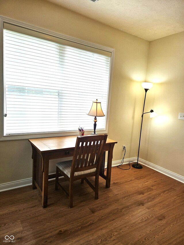 6956 Park Square Dr Unit D, Avon, IN 46123 - dining room with plenty of natural light, dark wood-style flooring, baseboards, and a textured ceiling