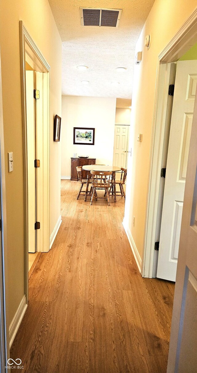 6956 Park Square Dr Unit D, Avon, IN 46123 - hall featuring wood finished floors and baseboards
