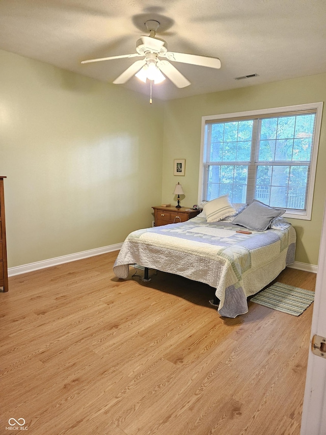 6956 Park Square Dr Unit D, Avon, IN 46123 - bedroom featuring wood finished floors, baseboards, and a ceiling fan