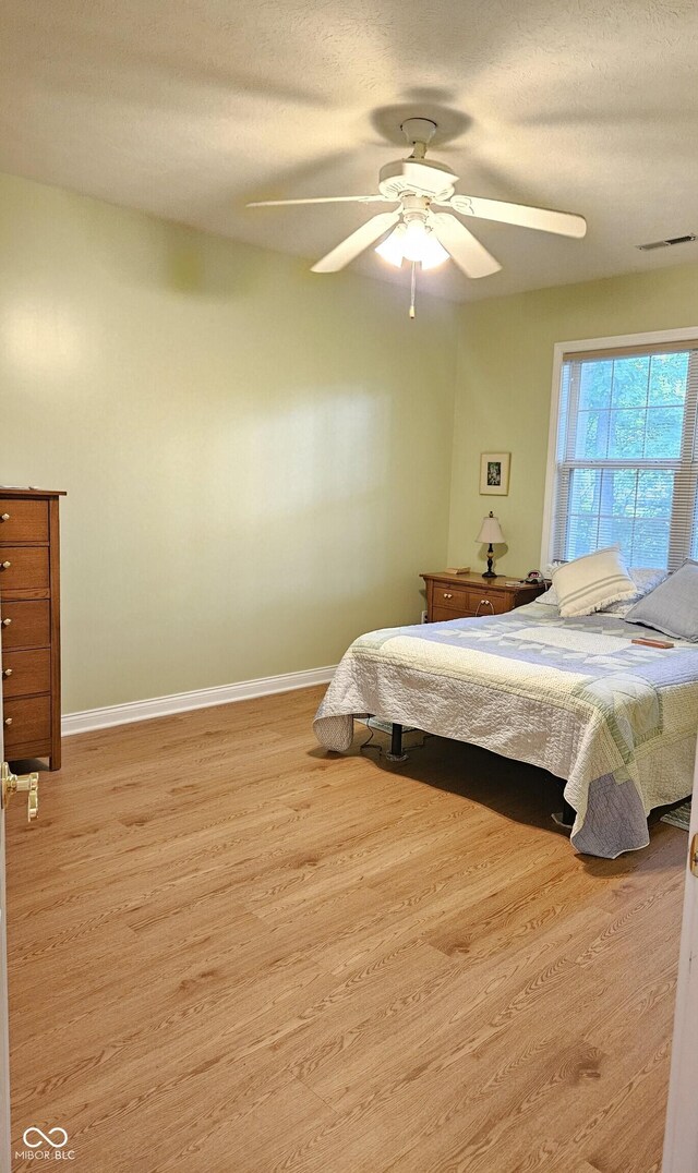 6956 Park Square Dr Unit D, Avon, IN 46123 - bedroom featuring wood finished floors, baseboards, and a ceiling fan