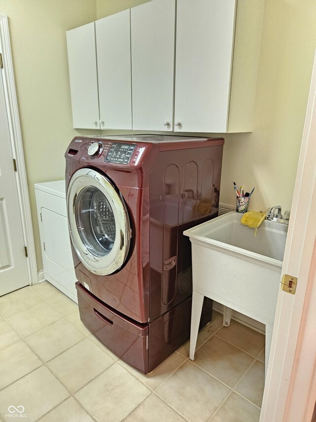 6956 Park Square Dr Unit D, Avon, IN 46123 - laundry room featuring cabinet space, light tile patterned floors, and washer and clothes dryer