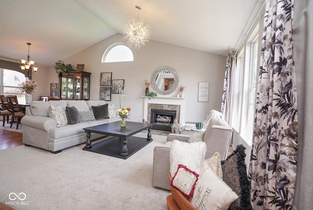 4342 Sequoia Ct, Greenwood, IN 46143 - living room with a chandelier, vaulted ceiling, a fireplace, and carpet flooring