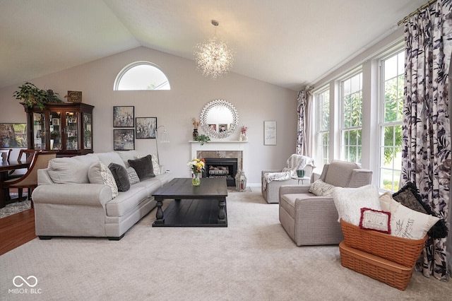 4342 Sequoia Ct, Greenwood, IN 46143 - living area with lofted ceiling, a tiled fireplace, and a chandelier