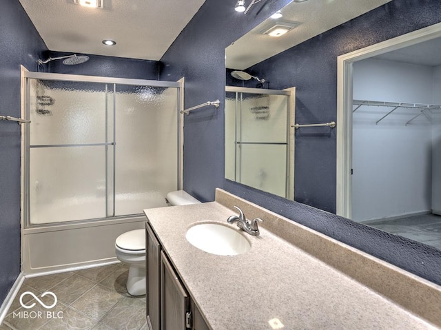 7657 Wheatgrass Ln, Noblesville, IN 46062 - full bathroom with toilet, vanity, enclosed tub / shower combo, a spacious closet, and tile patterned floors