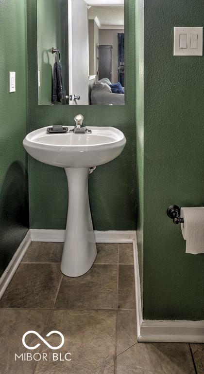 7657 Wheatgrass Ln, Noblesville, IN 46062 - bathroom with baseboards and tile patterned flooring