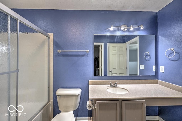 7657 Wheatgrass Ln, Noblesville, IN 46062 - full bathroom with a textured wall, vanity, toilet, and enclosed tub / shower combo