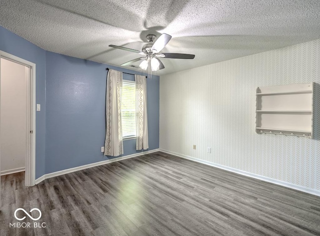 7657 Wheatgrass Ln, Noblesville, IN 46062 - unfurnished room with wood finished floors, baseboards, ceiling fan, and a textured ceiling