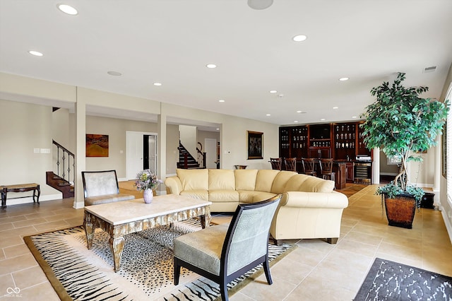 7635 Monte Carlo Way, Indianapolis, IN 46278 - living room featuring stairs, light tile patterned flooring, recessed lighting, and bar