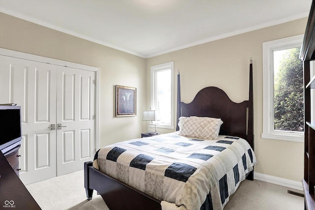 7635 Monte Carlo Way, Indianapolis, IN 46278 - bedroom with light carpet, a closet, multiple windows, and ornamental molding