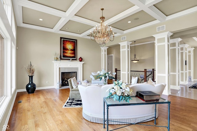 7635 Monte Carlo Way, Indianapolis, IN 46278 - living room with coffered ceiling, decorative columns, a fireplace with flush hearth, beam ceiling, and wood finished floors