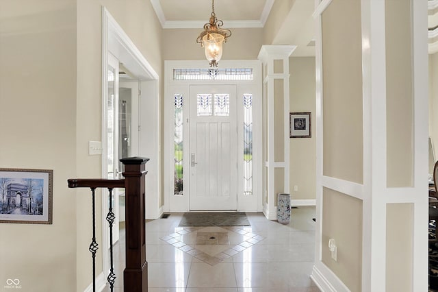 7635 Monte Carlo Way, Indianapolis, IN 46278 - tiled foyer with inlaid floor details, ornamental molding, and a chandelier