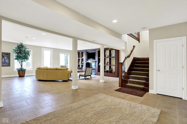7635 Monte Carlo Way, Indianapolis, IN 46278 - living room featuring tile patterned floors, stairs, and recessed lighting