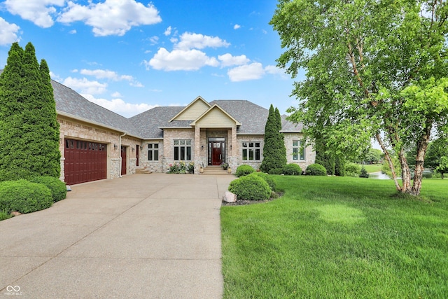 7635 Monte Carlo Way, Indianapolis, IN 46278 - view of front facade featuring a garage, concrete driveway, a front lawn, a shingled roof, and stone siding
