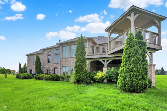 7635 Monte Carlo Way, Indianapolis, IN 46278 - rear view of property featuring a yard, brick siding, and a deck